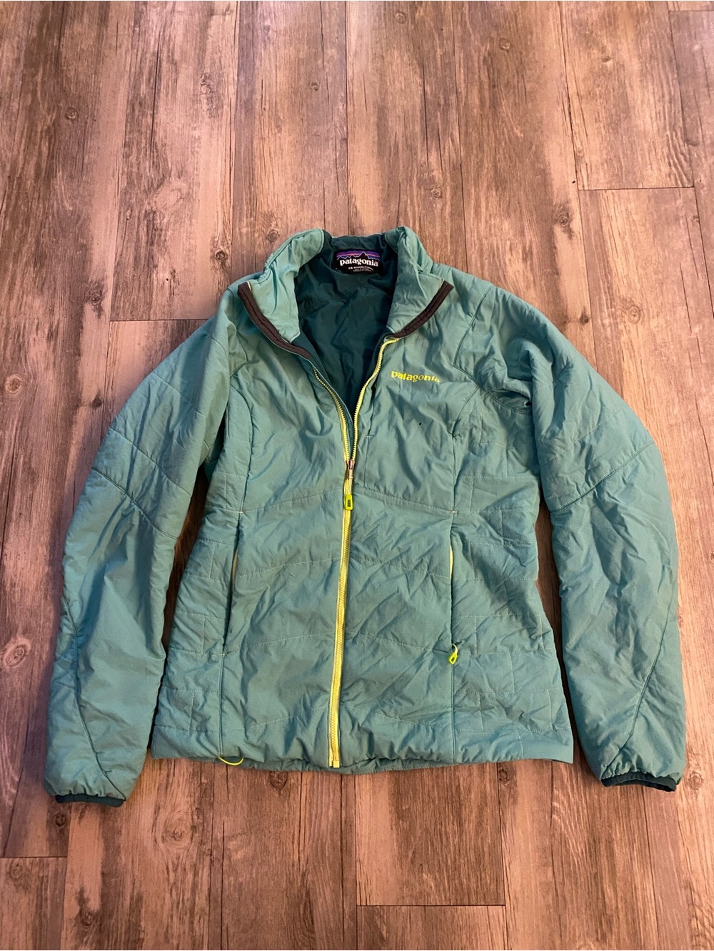 Patagonia Teal Jacket with Yellow Accents